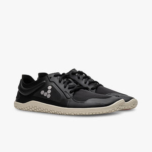 Black Vivobarefoot Primus Lite IV All Weather sneakers with textured beige soles and minimalist design.