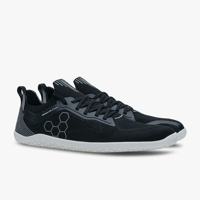 Black breathable knit sneakers with gray hexagonal pattern and white soles, low-profile design.