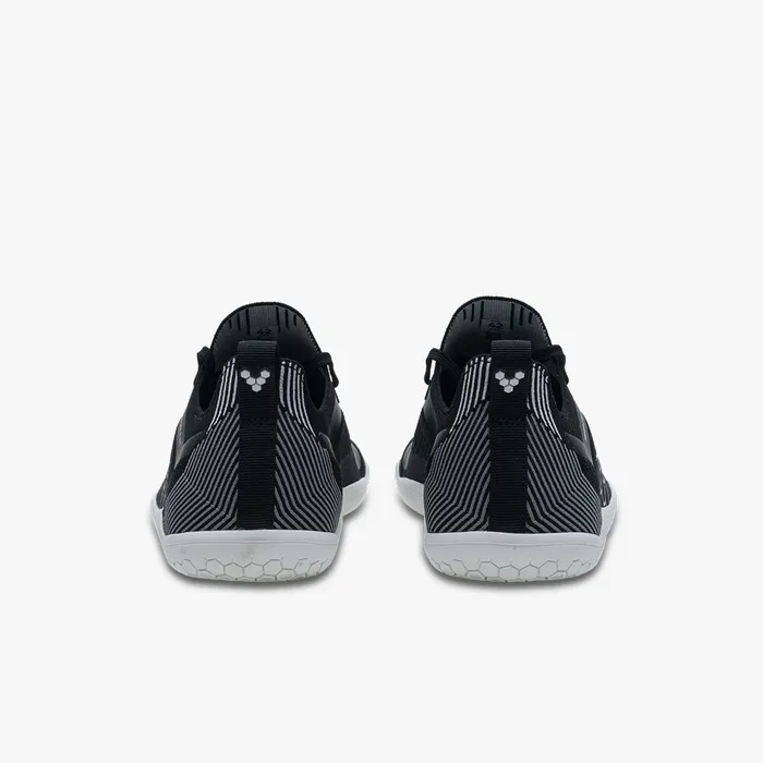 Men's Vivobarefoot Primus Lite Knit sneakers in black and gray textile, rear view.