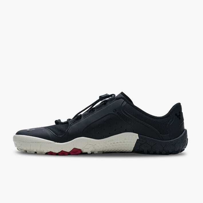 Black low-profile athletic shoe with white sole and red tread accents, sleek breathable design.