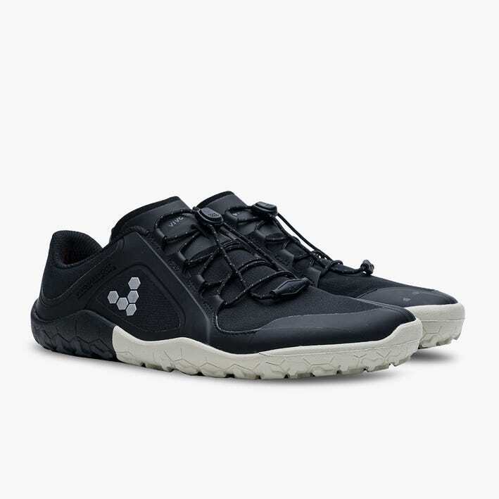 Black and gray low-profile athletic shoes with minimalistic lacing and textured soles.
