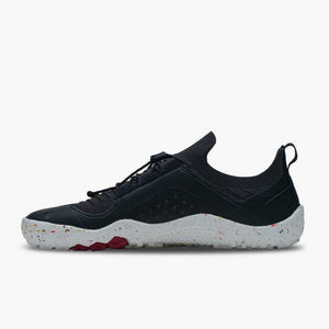 Black knit athletic shoe with white speckled sole and red traction details, low-profile design.