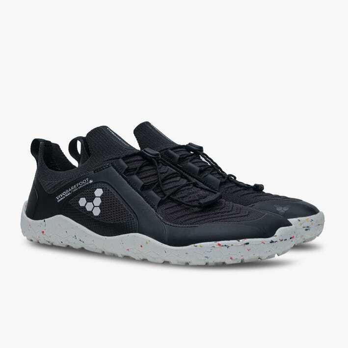 Black knit athletic shoes with speckled white soles and subtle white logo on the side.