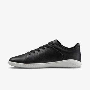 Black leather low-top sneaker with white sole and black laces, sleek minimalist design.