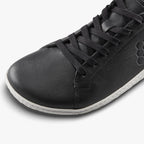 Black leather Vivobarefoot Geo Court III sneaker with hexagonal logo and white sole detail.