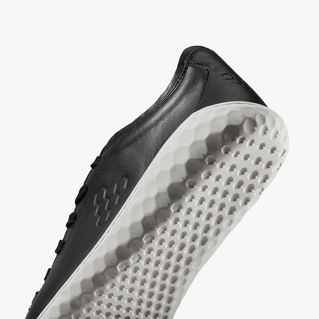 Vivobarefoot Women's Geo Court III black leather low-top sneaker with textured white sole.