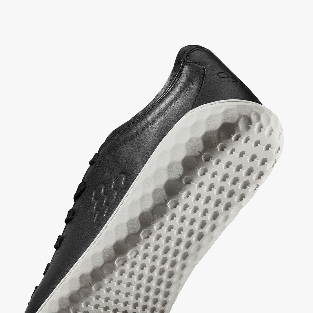 Vivobarefoot Women's Geo Court III black leather low-top sneaker with textured white sole.