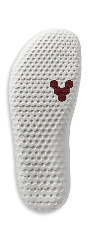 White textured shoe sole with a red hexagonal logo near the ball of the foot.