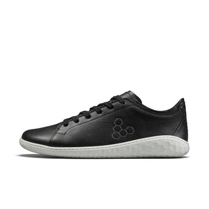Black leather low-top sneaker with white textured sole and hexagon logo on side.