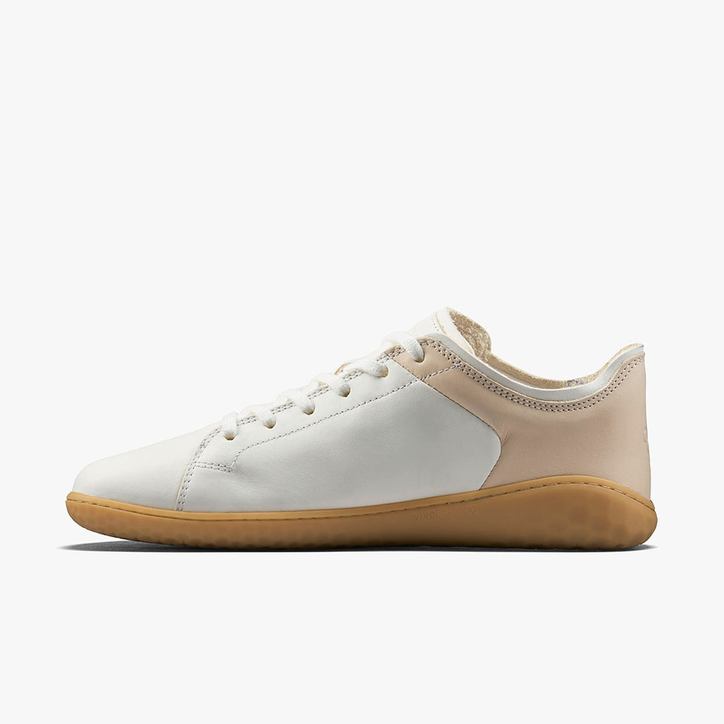 White and rose leather low-top sneaker with gum sole and lace-up front.