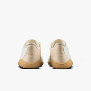 Pair of rose leather Vivobarefoot Geo Court III sneakers with beige accents and gum soles, viewed from the back.