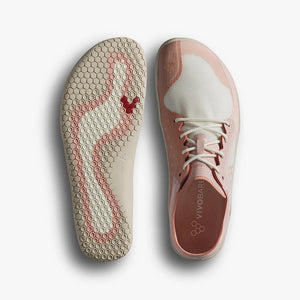 Dusty rose athletic shoe with white toe cap and honeycomb-patterned sole featuring a red Vivobarefoot logo.