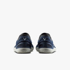 Pair of midnight blue athletic shoes with grey soles and subtle logo on heels, viewed from back.