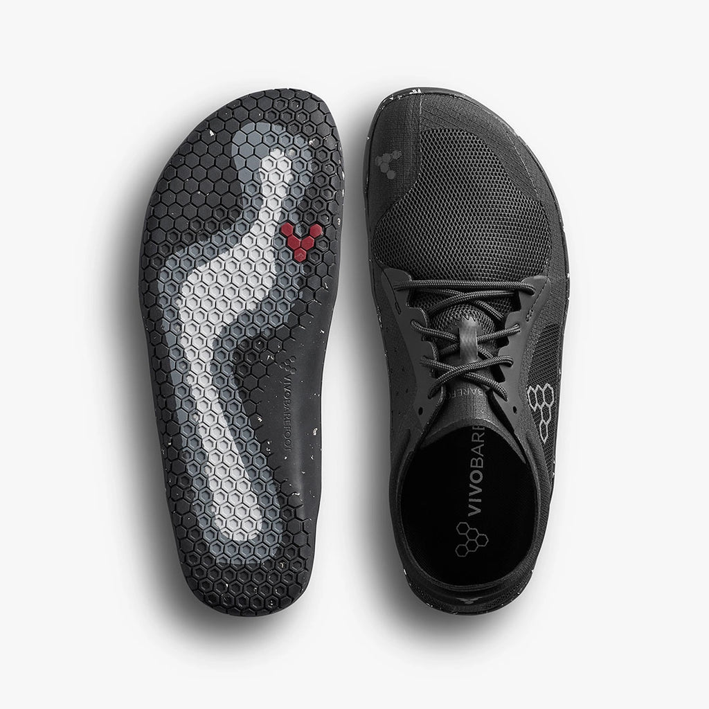 Black Vivobarefoot Primus Lite 3.5 athletic shoe with breathable mesh upper and flexible hexagonal sole pattern.