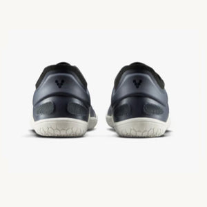 Pair of navy athletic sneakers with textured white soles, viewed from the back.