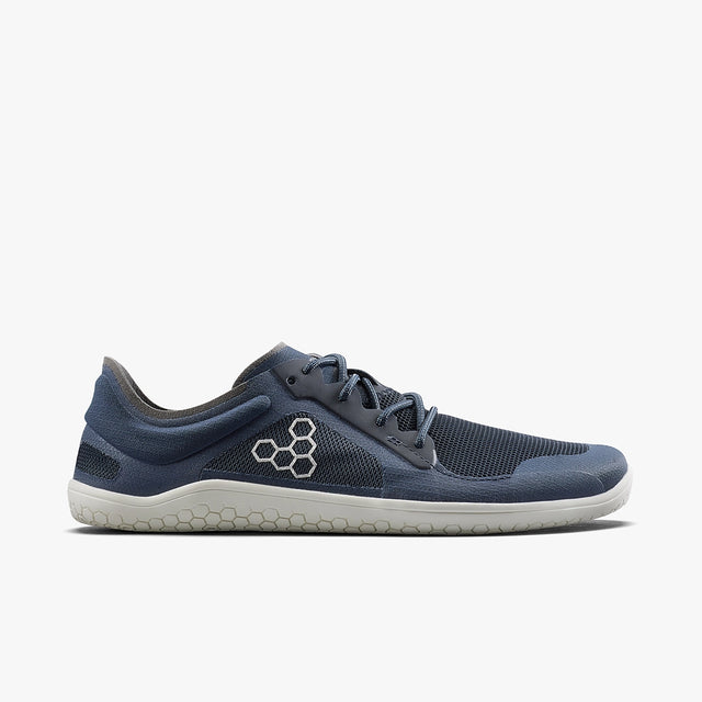 Navy blue athletic shoe with mesh upper, grey honeycomb logo, white textured sole, and lace-up design.