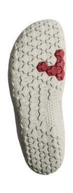 Off-white textured sole with hexagonal tread pattern and red hexagon insert near the center.