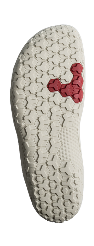 Off-white textured sole with hexagonal tread pattern and red hexagon insert near the center.