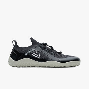 Black and gray knit low-top trail shoe with hexagonal pattern logo and elastic laces.