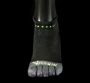 Black and grey toe socks anklet with green accents and XOSKIN logo on toes, snug fit on foot.