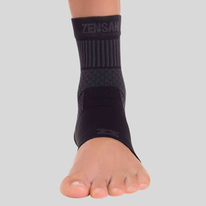 Black Zensah compression ankle sleeve with ribbed texture and subtle logo band.