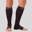 Black Zensah compression ankle and calf sleeves with branded top band and open toes.