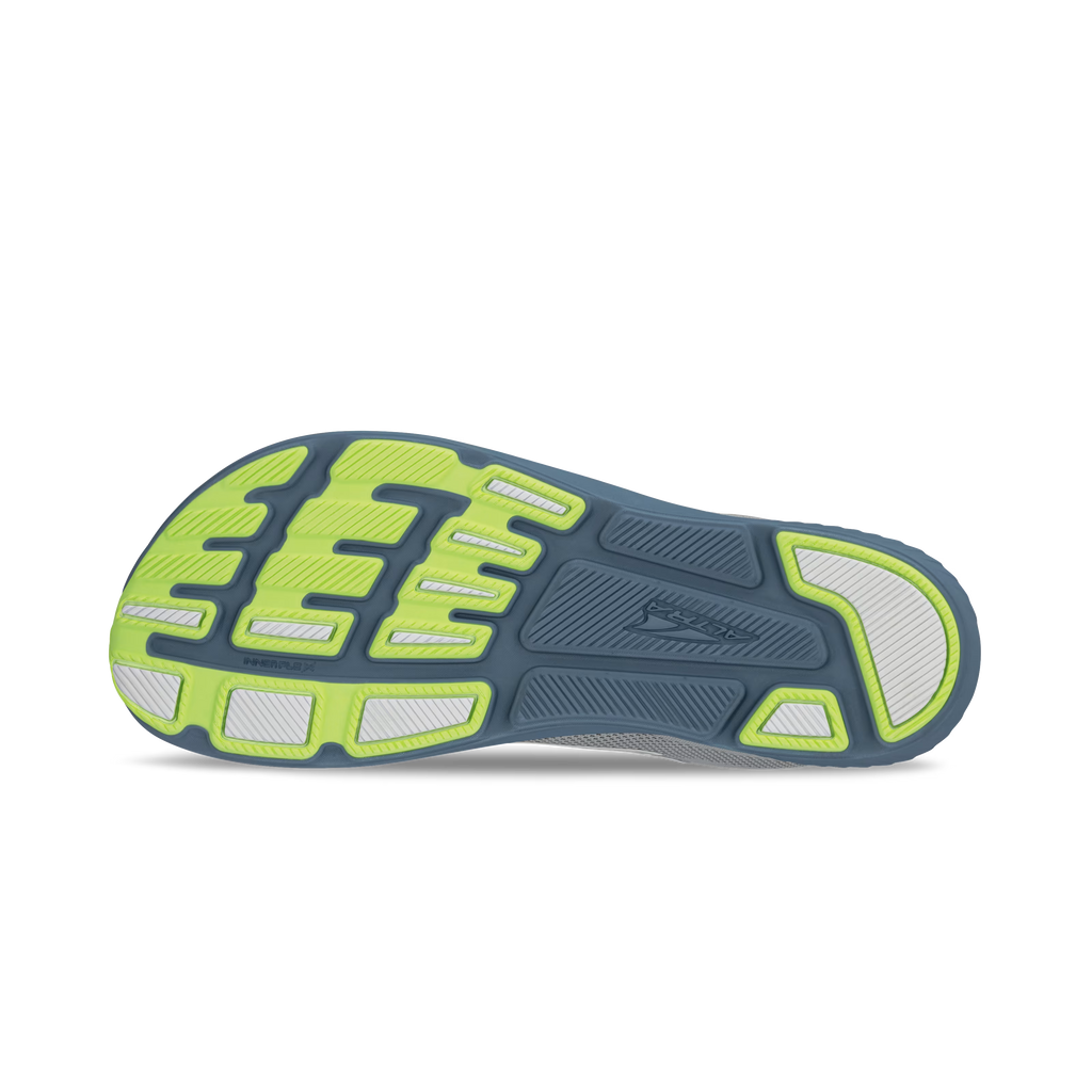 Gray and lime running shoe sole with textured tread and flex grooves.