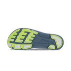 Gray and lime running shoe sole with textured tread and flex grooves.