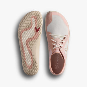 Pink athletic shoe with textured sole and brand logo on a light gray background