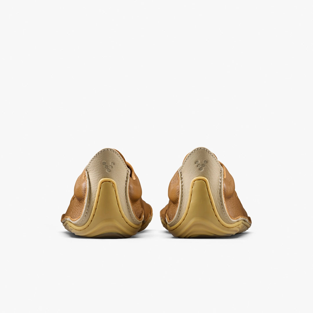 Back view of brown leather shoes with a white background