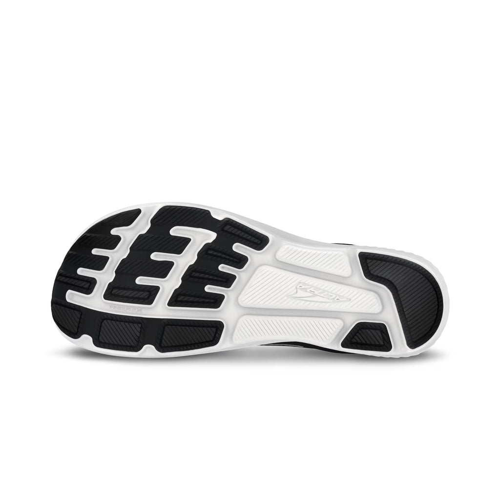 Black and white athletic shoe sole with textured treads and embossed Altra logo.