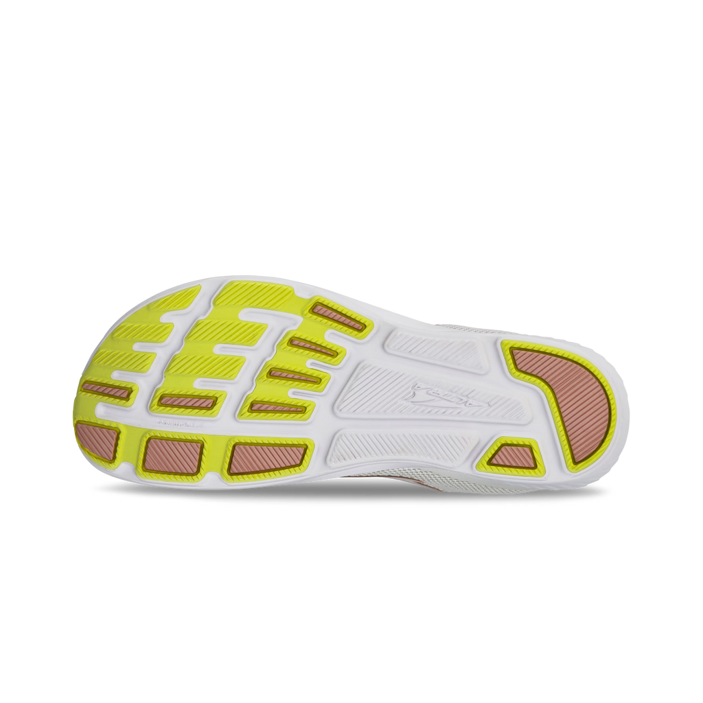 Light gray and white athletic shoe sole with yellow and brown traction accents.